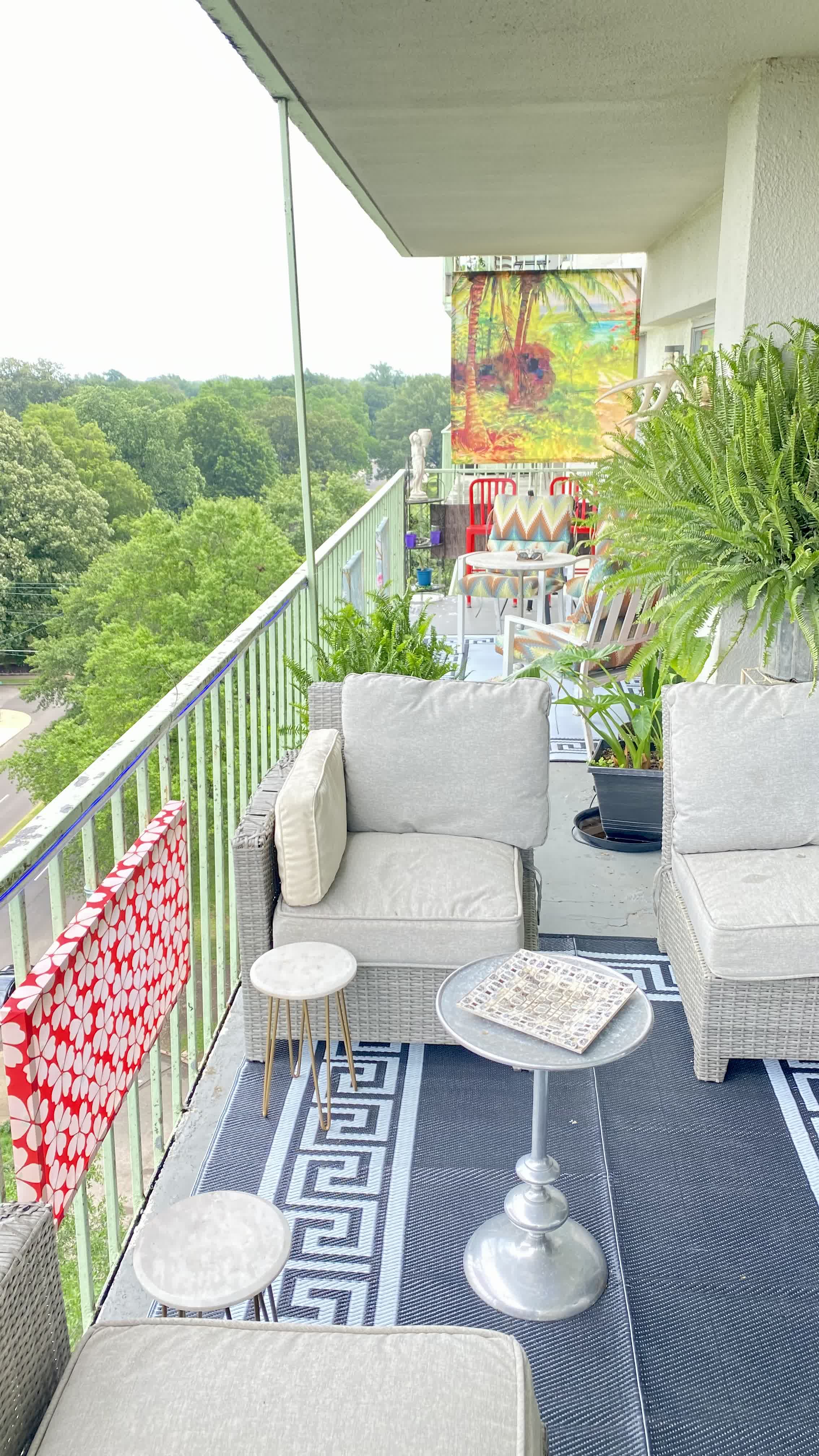 Central Gardens Penthouse Balcony Lounge: Greek Key Runner, Grey Wicker Sectional & Railing Art