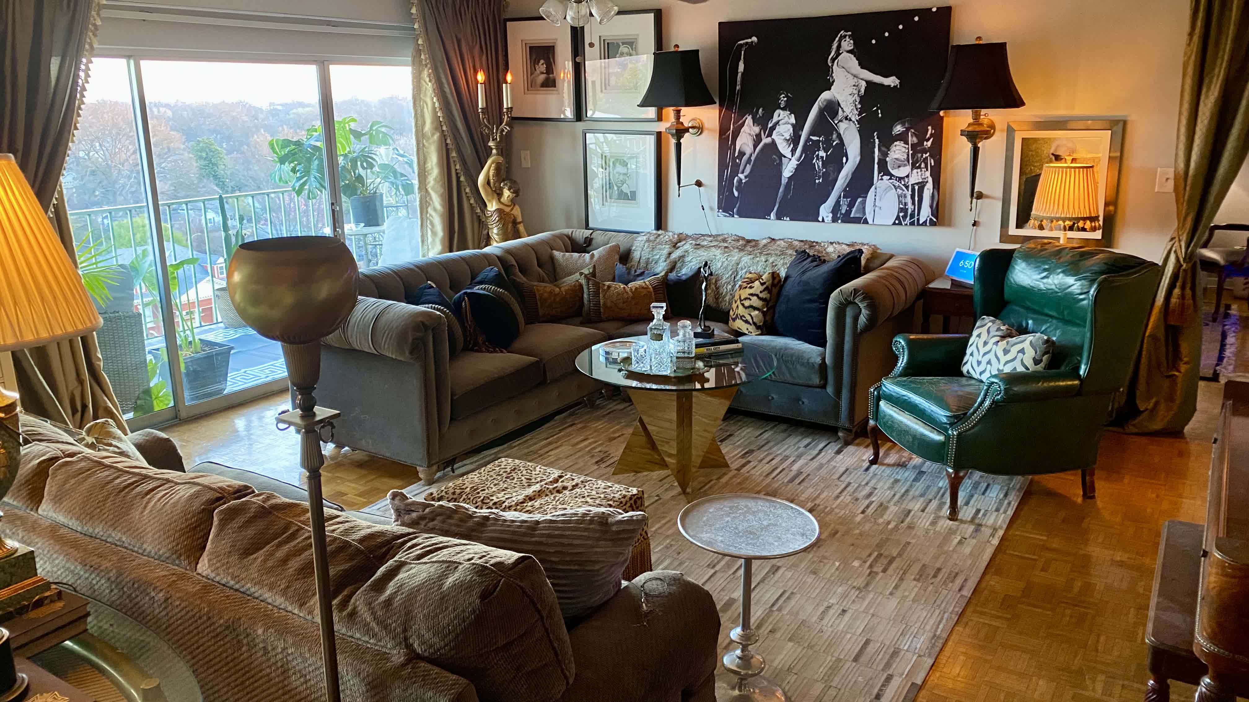 Central Gardens Living Salon Daylight Reveal: Stevan's Tina Turner Fabric Art, Gray Chesterfield Diamond-Tufted Sectional & Scalamandré Leopard Stool