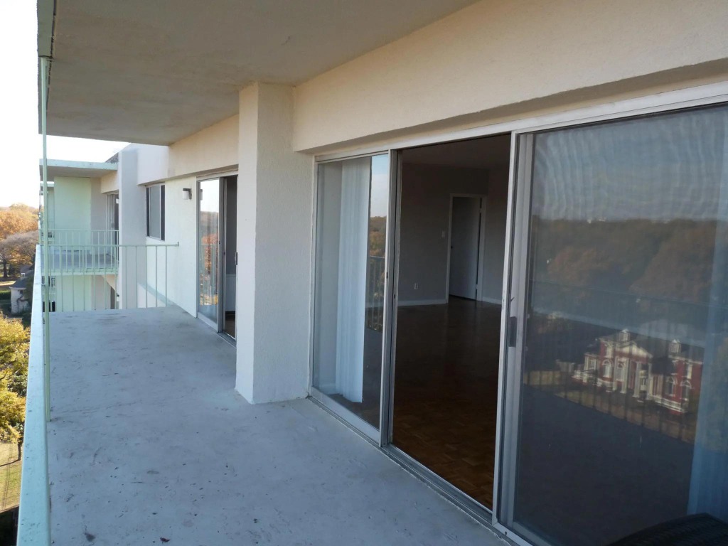 Central Gardens Balcony Walkway Before: Narrow raw concrete walkway and blank stucco column