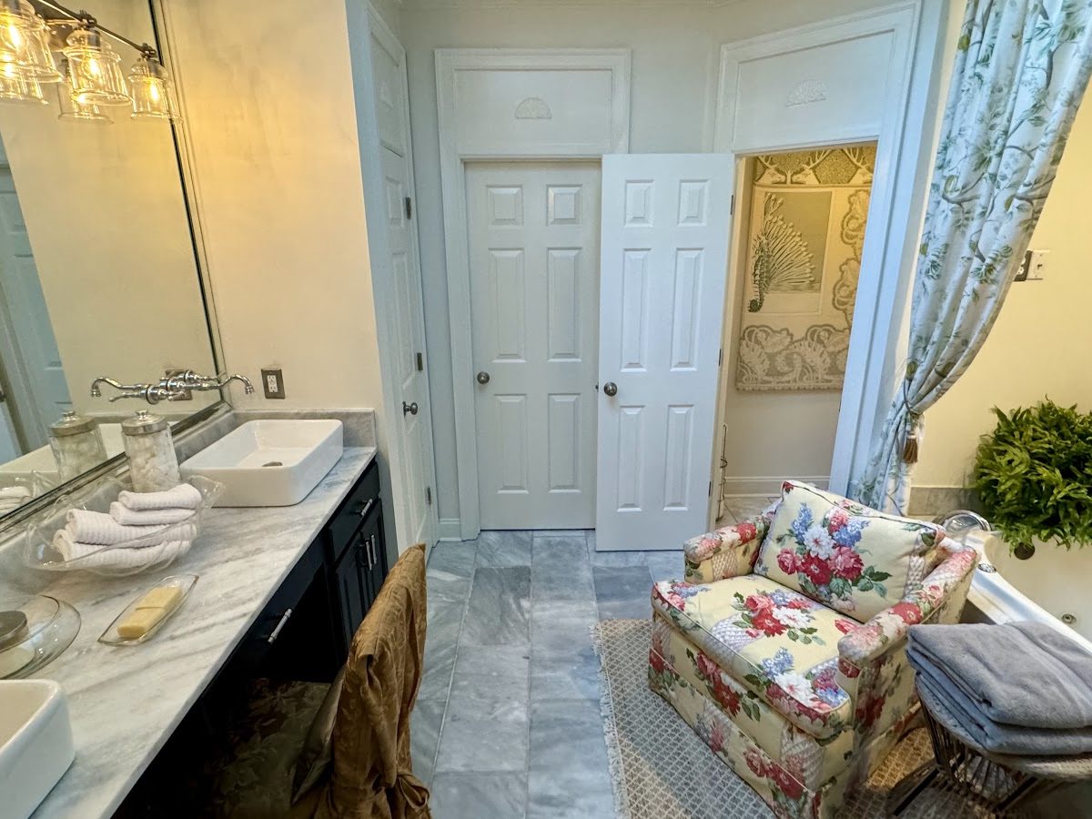 Southwind Primary Bath After: Seahorse Fabric Mural, Floral Armchair & Marble Details