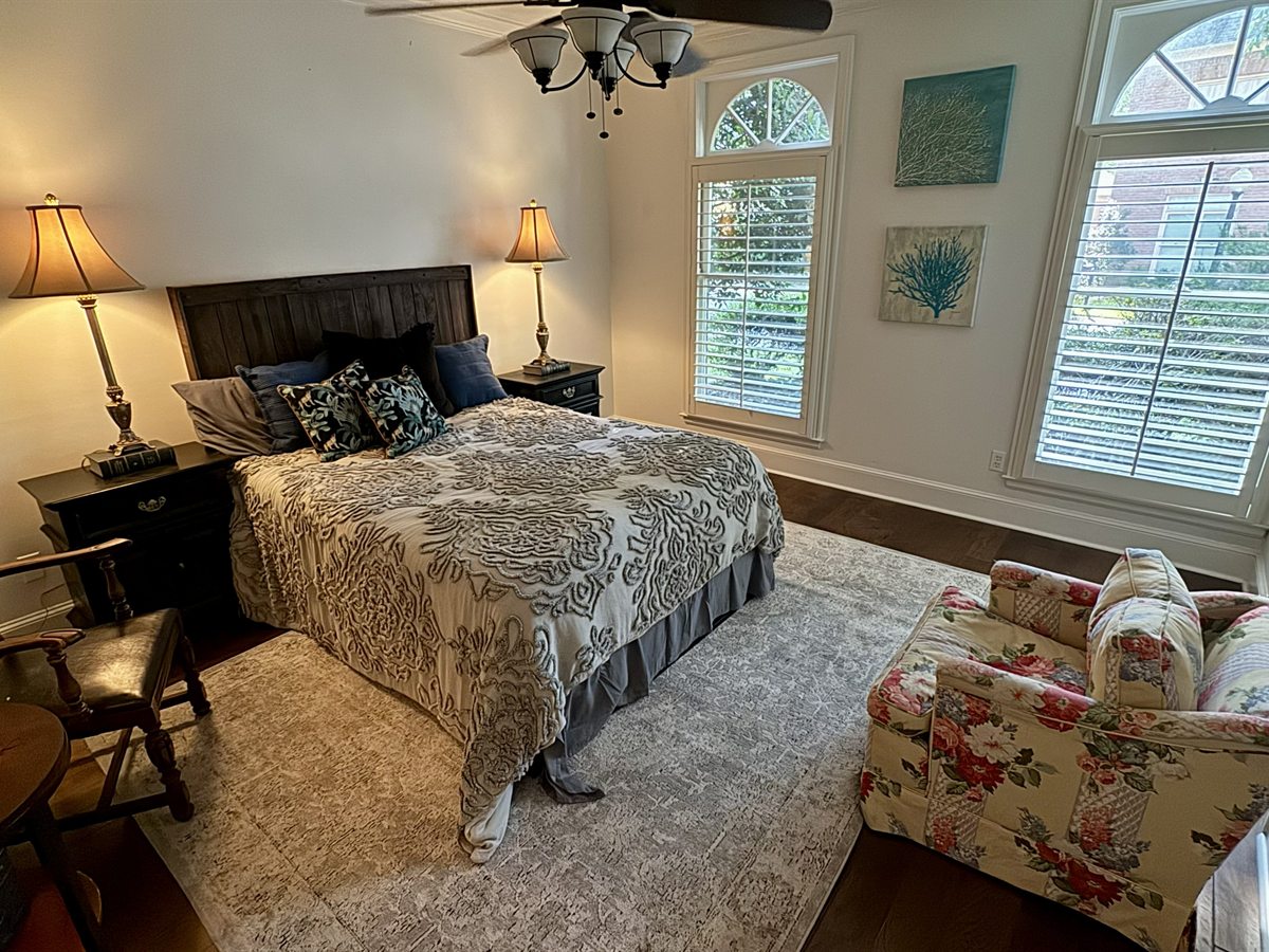 Southwind Downstairs Bedroom After: Artisan Timber Headboard & Amber Lighting