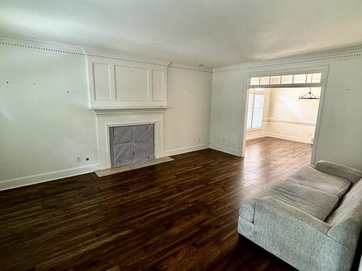 Southwind Living Room Before: Cavernous room with bare windows and stark builder walls