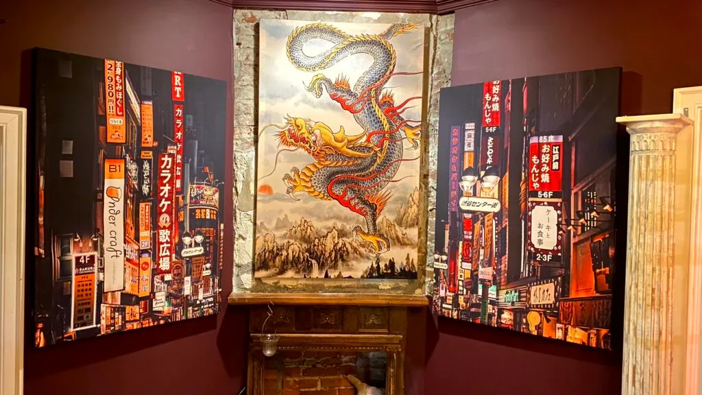 Custom wall art Memphis installation featuring vibrant large-format fabric panels with hand-painted details in a styled interior.