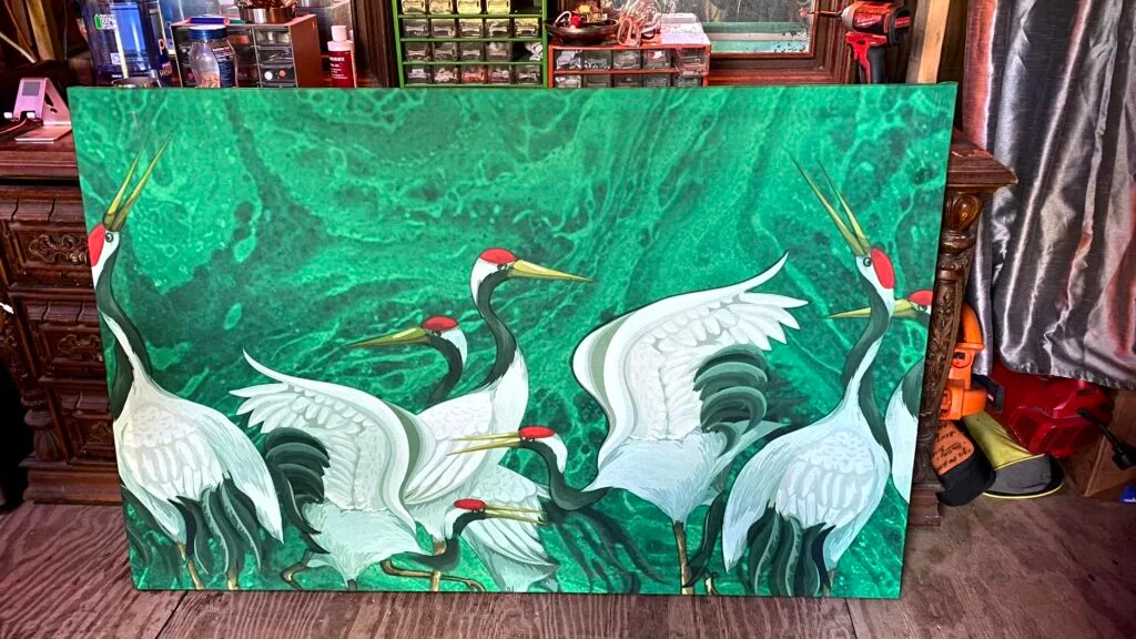 Massive custom wall art Memphis installation featuring large-scale vibrant green fabric prints with Japanese crane motifs.