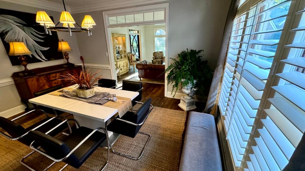 Home Staging Southwind Memphis | Sell Your House Faster 5 Staged formal dining room showcasing warm Sherwin-Williams Shiitake walls and transitional lighting.