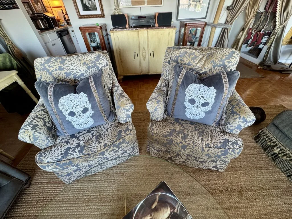Symmetrical pair of custom lace skull throw pillows for an edgy, high-end look.