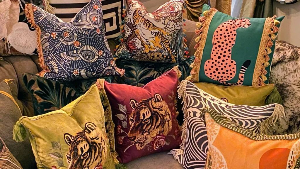 Luxury living room sofa styled with a diverse variety of custom throw pillows.