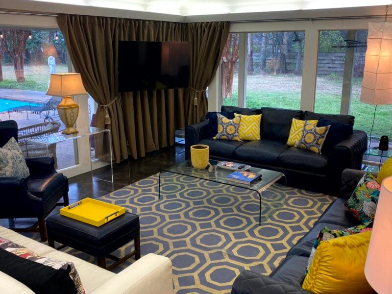 Elegant living room interior design showcasing high-end furnishings and sophisticated pattern mixing in the Clarksdale luxury poolhouse guesthouse conversion.